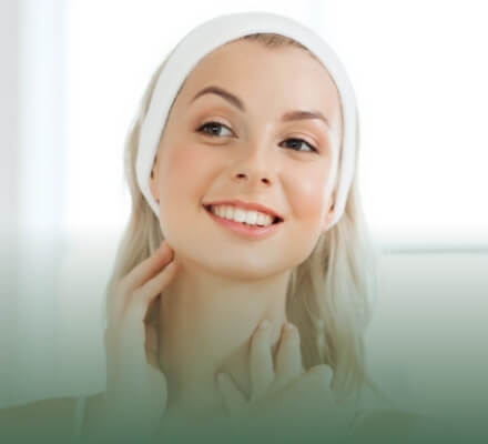 Close-up of a woman's beautiful face with natural makeup and a soft smile