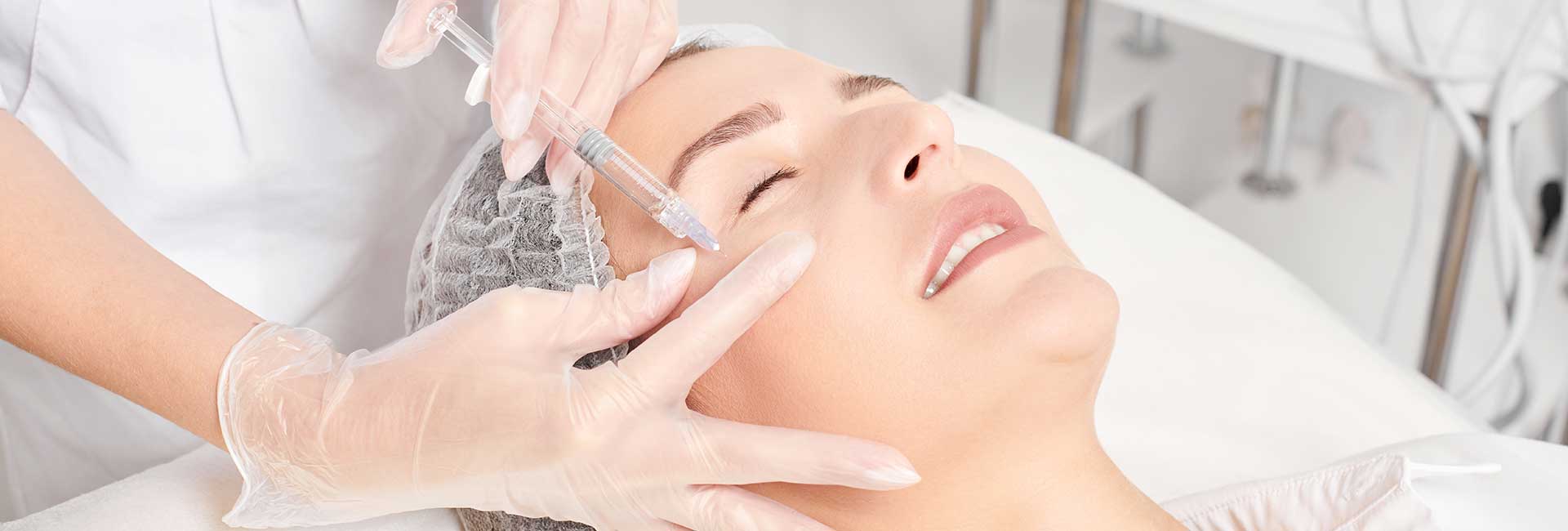 Woman receiving filler injections